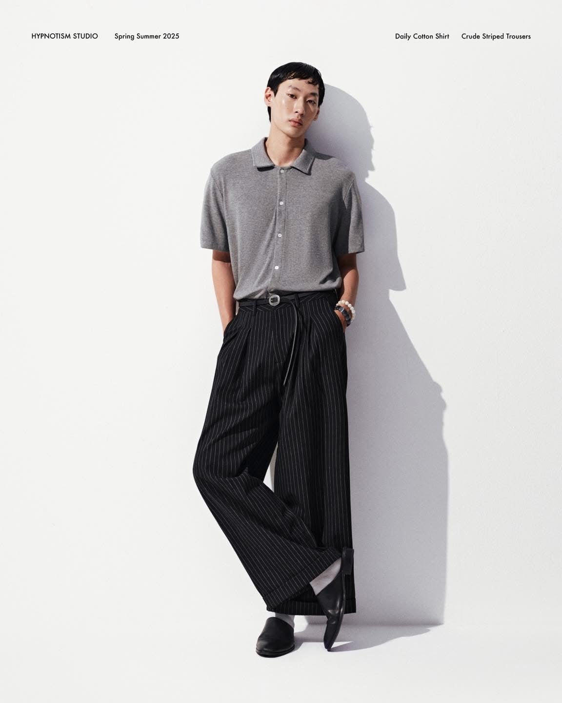 BLACK STRIPED CRUDE TROUSERS