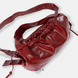 RED DRAWSTRING CROSSBODY