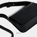 BLACK DAILY FLAP BAG by ARYA in synthetic microfiber leather, dimensions 8.66 x 5.51 x 3.15 inches, available at ASTOUD.