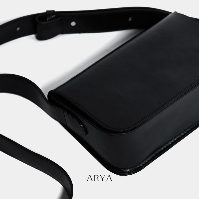 BLACK DAILY FLAP BAG by ARYA in synthetic microfiber leather, dimensions 8.66 x 5.51 x 3.15 inches, available at ASTOUD.